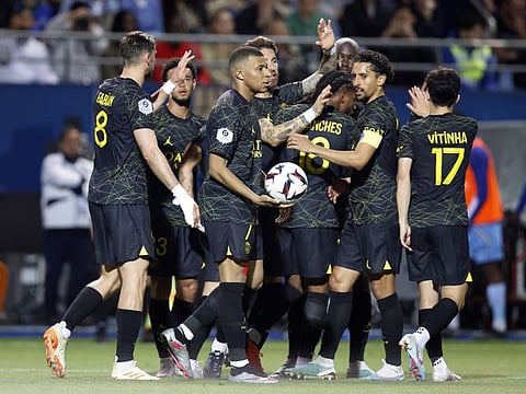 Paris St Germain's Kylian Mbappe and teammates celebrate a goal against Troyes in a Ligue 1 match Stade de l'Aube in May.