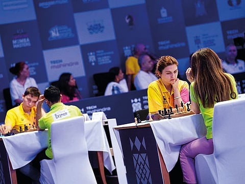 Andrey Esipenko, far left in yellow, and Bella Khotenashvili on the adjoining table, proved to be the stars for Ganges Grandmasters.