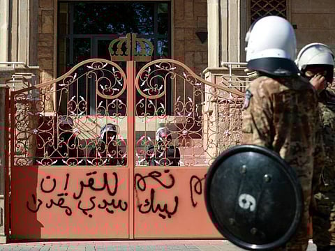 File image: Iraqi security forces guard the graffiti-covered entrance to the Swedish embassy in Baghdad after protesters reportedly breached the building briefly over the burning of the Quran by an Iraqi living in Sweden, on June 29, 2023