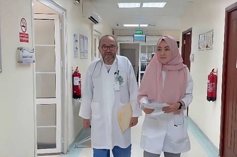 Dr Hashem and his dentist daughter Afnan at work.