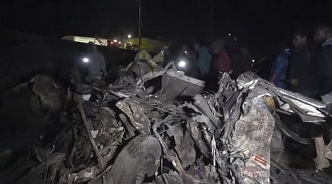 This video grab taken from an AFPTV video on June 30, 2023 shows wreckage from vehicles on the scene after an accident on the highway between the towns of Kericho and Nakuru.