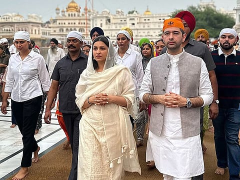 Bollywood actress Parineeti Chopra with her politician fiance Raghav Chadha at the Golden Temple in Amritsar, India.