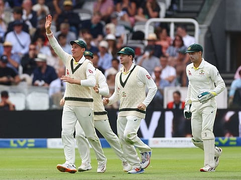 Australia's Steve Smith celebrates with Marnus Labuschagne after taking a catch to dismiss England's Ollie Robinson off the bowling of Pat Cummins during the second Test at Lords on Sunday.
