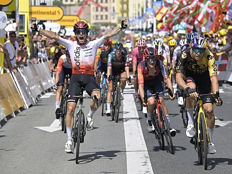 Cofidis' Victor Lafay celebrates as he crosses the finish line to win Stage 2 - Vitoria Gasteiz to San Sebastian - of the Tour de France on Sunday.