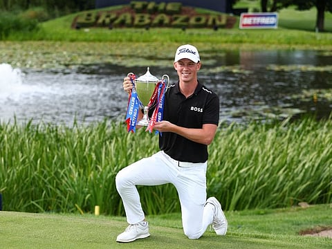 New Zealand's Daniel Hillier poses with the trophy after winning the British Masters at The Belfry, Sutton Coldfield, Britain on Sunday.