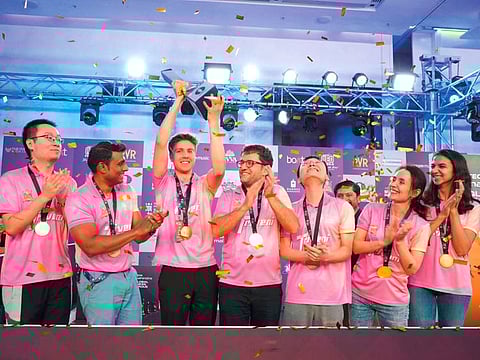 Triveni Continental Kings celebrate with the trophy after their win over upGrad Mumba Masters in the inaugural Global Chess League in Dubai on Sunday.