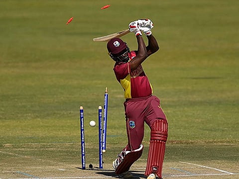 Kevin Sinclair of West Indies is bowled by Chris Sole of Scotland during the ICC Men's Cricket World Cup Qualifier Zimbabwe 2023 Super 6 match between Scotland and West Indies at Harare Sports Club on July 01, 2023 in Harare, Zimbabwe.