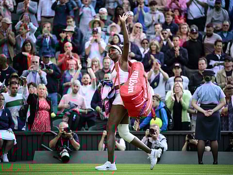 US player Venus Williams waves to the audience as she leaves the court following her defeat against Ukraine's Elina Svitolina at the Wimbledon Championships on Monday.