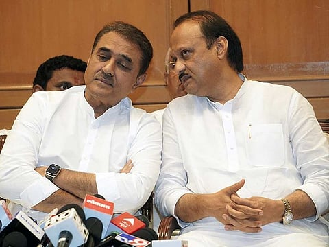 Maharashtra Deputy Chief Minister Ajit Pawar in a conversation with Nationalist Congress Party (NCP) leader Praful Patel during a press conference, at Sahyadri State Guest House, in Mumbai on Monday, July 3, 2023.