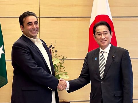 Pakistan’s Foreign Minister Bilawal Bhutto Zardari shakes hands with Japanese Prime Minister Fumio Kishida during a meeting in Tokyo on July 3, 2023.