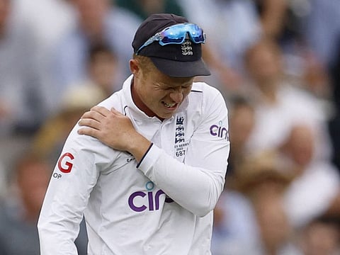 England's Ollie Pope walks off for medical attention after injuring his shoulder while fielding during the second Test at Lord's on June 30.