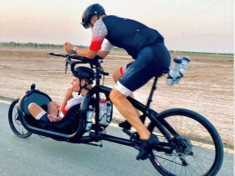Nick Watson with his son Rio during the cycling challenge on Dubai roads in June.