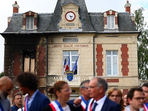French elected officials attend a "citizens gathering" in front of the town hall of Persan, which was partially burnt during night clashes, following the death of Nahel, a 17-year-old teenager killed by a French police officer in Nanterre during a traffic stop, in Persan, near Paris, France, July 3, 2023.