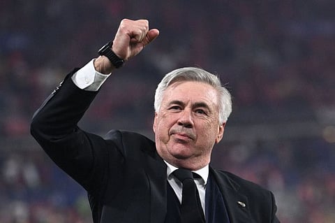 Real Madrid's Italian coach Carlo Ancelotti gestures as he celebrates his team's victory during the Uefa Champions League final against Liverpool in May.