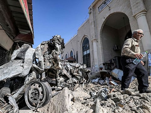 The rubble and remains of a destroyed vehicle outside a mosque in the West Bank city of Jenin on July 5, 2023, after the Israeli army declared the end of a two-day military operation in the area.