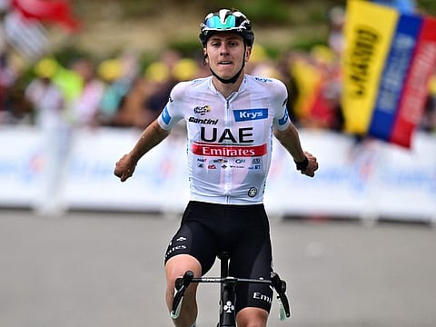 UAE Team Emirates' Slovenian rider Tadej Pogacar cycles to the finish line to win the 6th stage of the Tour de France race in France on Thursday.