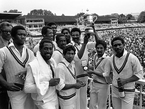 1979 — West Indies captain Clive Lloyd, surrounded by Vivian Richards, Alvin Kallicharan, Deryck Murray, Gordon Greenidge, Michael Holding, Joel Garner, Colin Croft and Collis King, displays the Prudential World Cup at Lord's. West Indies retained the cup with a 92-run victory over England in the final.