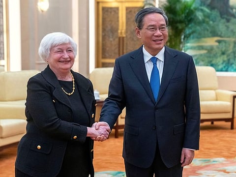 Chinese Premier Li Qiang, right, shakes hands with Treasury Secretary Janet Yellen, left, during a meeting at the Great Hall of the People in Beijing.