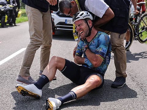 Astana Qazaqstan Team's British rider Mark Cavendish receives medical attention after suffering a crash during the 8th stage of the 110th edition of the Tour de France cycling race, 201 km between Libourne and Limoges, in central western France, on July 8, 2023
