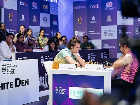 Magnus Carlsen is keenly watched by the spectators that includes former Indian tennis ace Mahesh Bhupathi during the global chess league in Dubai.