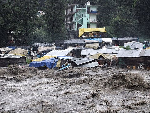 A swollen River Beas following heavy rains in Kullu, Himachal Pradesh, India, Sunday, July 9, 2023.
