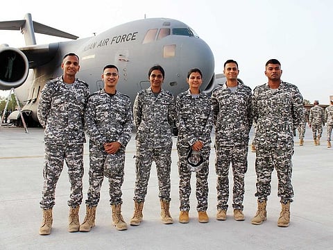 Indian Air Force (IAF) air warriors pose for a picture as IAF flying contigent departs for participation in the French 'Bastille Day' Flypast, on Friday, July 7, 2023.