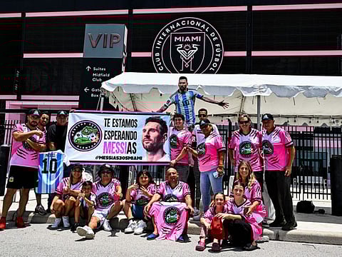 Fans of Argentina's Lionel Messi wait for his arrival at the DRV PNK Stadium in Fort Lauderdale, Florida on Tuesday.