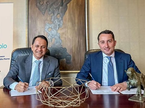 The agreement for the Nader project being signed by key officials.