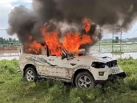 Smokes and flame billow from a vehicle that has been set ablaze by miscreants after West Bengal elections, at Belon village under Chakulia police station limits, in Uttar Dinajpur