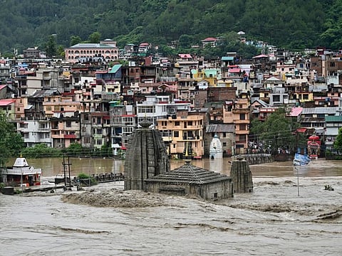 A submerged temple is pictured as the river Beas overflows following heavy rains in Mandi in the northern state of Himachal Pradesh.