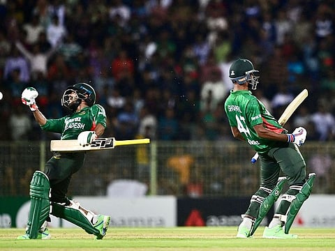 Bangladesh's Towhid Hridoy (L) and Shoriful Islam (R) celebrate after winning the first Twenty20 international against Afghanistan at the Sylhet International Cricket Stadium in Sylhet on July 14, 2023.