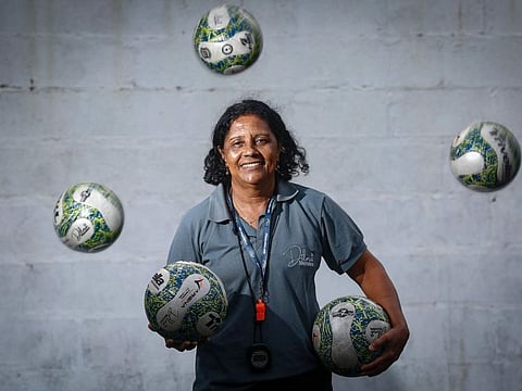 Women's football coach Dilma Mendes, 59, at the Arena 2 de Julho Football School located in the city of Camacari, Bahia state, Brazil.