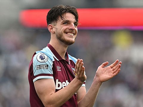 West Ham United's English midfielder Declan Rice applauds during a tribute ceremony for West Ham United's English midfielder Mark Noble's last game on May 15, 2022.
