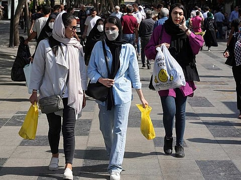 Women shop in the old main bazaar of Tehran, Iran, Saturday, Oct. 1, 2022. Iranian police have announced a new campaign to force women to wear the Islamic headscarf.