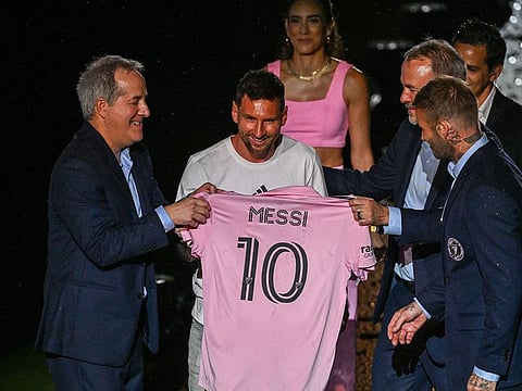 Argentine soccer star Lionel Messi (2nd L) is presented by (from R) owners of Inter Miami CF David Beckham, Jose R. Mas and Jorge Mas as the newest player for Major League Soccer's Inter Miami CF, at DRV PNK Stadium in Fort Lauderdale, Florida.