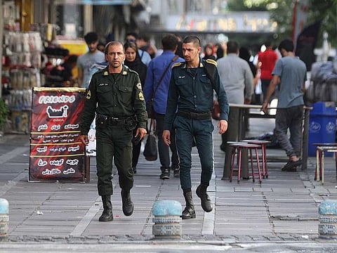 Iran's police forces walk on a street during the revival of morality police in Tehran, Iran, July 16, 2023.