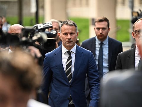 Former Manchester United star and Wales manager Ryan Giggs leaves the Manchester Minshull Street Crown Court in Manchester on August 31.