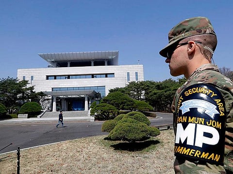 A US soldier stands outside of the Peace House, the venue for the planned summit between South Korean President Moon Jae-in and North Korean leader Kim Jong Un during a press tour at the southern side of the Panmunjom in the Demilitarized Zone, South Korea on April 18, 2018.