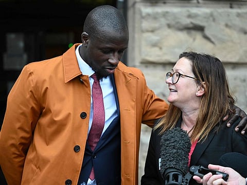 French footballer Benjamin Mendy stands with his solicitor outside Chester Crown Court in Chester, north-west England, on July 14.