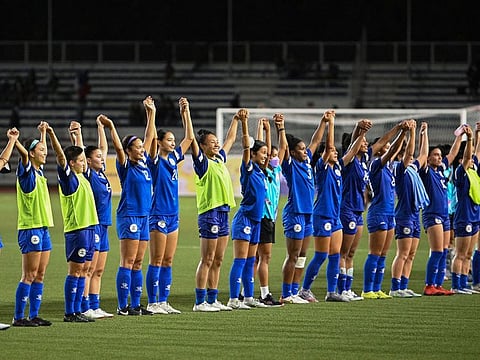 File image: This photo taken on July 15, 2022 shows members of the Philippine women's footbal team acknowledging the crowd after defeating Vietnam in the women's Asian Footbal Federation semi-final match at Rizal memorial stadium in Manila