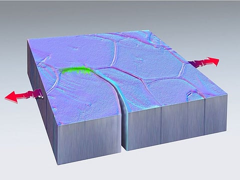 Green marks the spot where a fissure formed, then fused back together in this artistic rendering of nanoscale self-healing in metal, discovered at the U.S. government's Sandia National Laboratories, in this undated handout image.