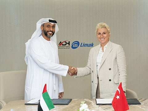 Eng. Hamad Salem Al Ameri, CEO and Managing Director of Alpha Dhabi and Ebru Ozdemir, Chairperson of Limak sign the initial agreement to drive sustainable development in the UAE and Turkey.