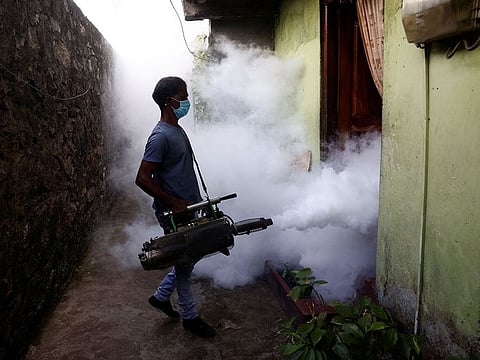 A health worker fumigates against mosquitoes in a residential area, as Sri Lanka tries to curb dengue fever across the island in Colombo, Sri Lanka July 12, 2023.