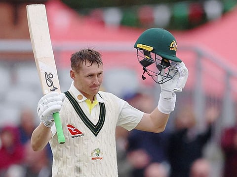 Australia's Marnus Labuschagne celebrates reaching 100 on day four of the fourth Ashes Test match between England and Australia at Old Trafford cricket ground in Manchester, on July 22, 2023.