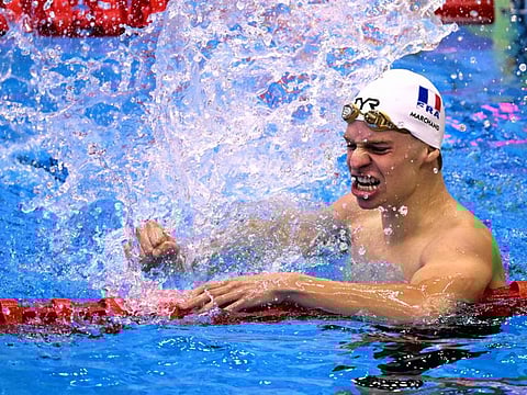 France's Leon Marchand reacts after winning in the final of the men's 400m medley swimming event during the World Aquatics Championships in Fukuoka on Sunday.