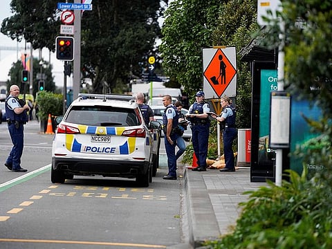 Police officers stand at the scene of a shooting in downtown Auckland on July 20, 2023. New Zealand Prime Minister Chris Hipkins said a shooting that killed two people in central Auckland hours before the women's football World Cup opener July 20, 2023 was not linked to a national security threat and the tournament will go ahead as planned.
