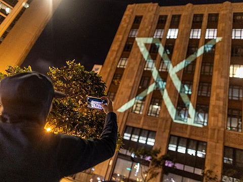 Twitter's new logo is seen projected on the corporate headquarters building in downtown San Francisco, California, U.S. July 23, 2023