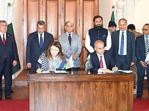 Managing Director of Pakistan LNG Limited, Masood Nabi (right), and CEO of Azerbaijan’s SOCAR Trading, Mariam Almaszade, signing an agreement for LNG cargo in Lahore on July 24, 2023.