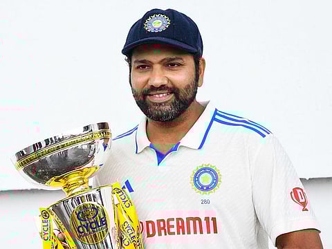 India skipper Rohit Sharma holds the winner's trophy at the end of the fifth and final day of the second Test against West Indies at Queen's Park Oval in Port of Spain, Trinidad and Tobago, on July 24, 2023.