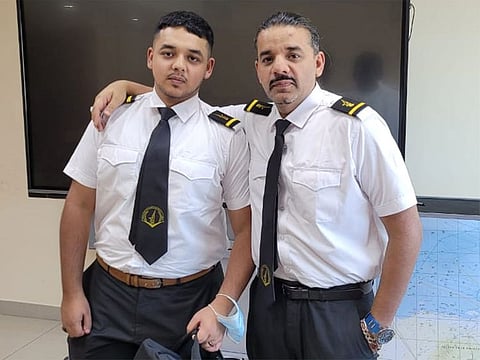 Batchmates in arms: Suleiman Mahmood, right, with his son Hashir Suleiman.